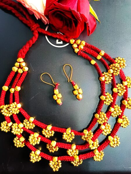 Elegant, three layered, brass sunflower petal motifs, partywear, with earrings, maroon colour