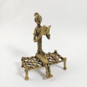 Timeless Tribal Art, Dokra metal Art, Hand-made, Collectible show-piece, Figurine of lady sitting on a Cot & Reading